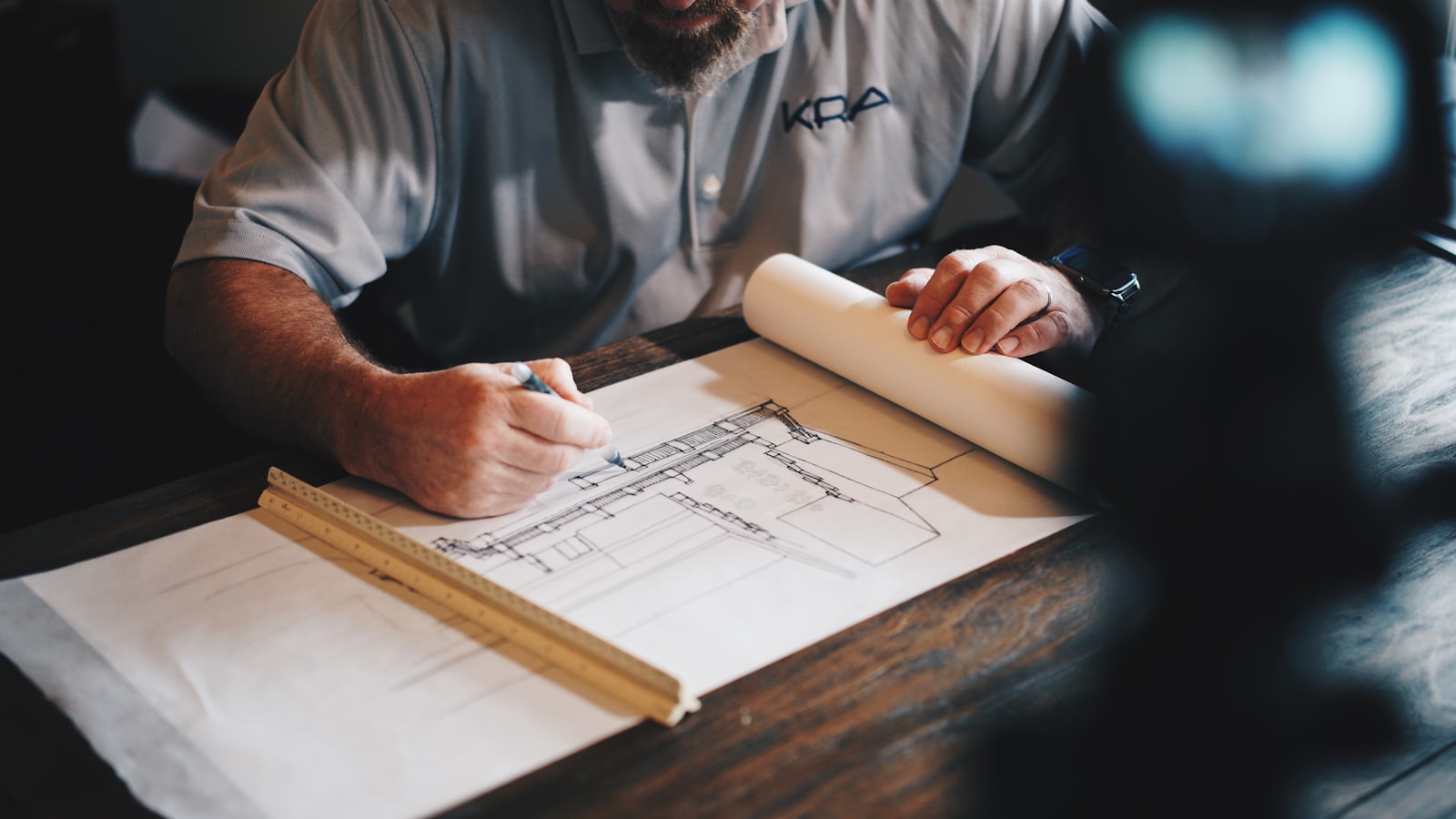 ASD engineer reviewing blueprints